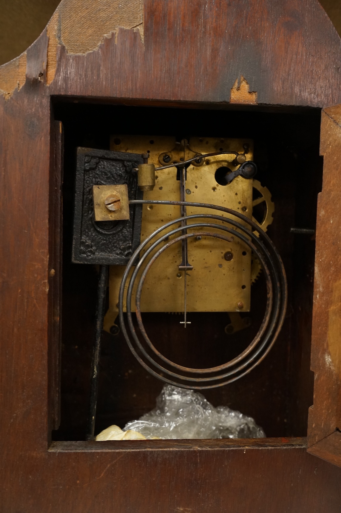 An early 20th century inlaid mantel clock with key and pendulum and a brass cased carriage timepiece, largest 32cm high